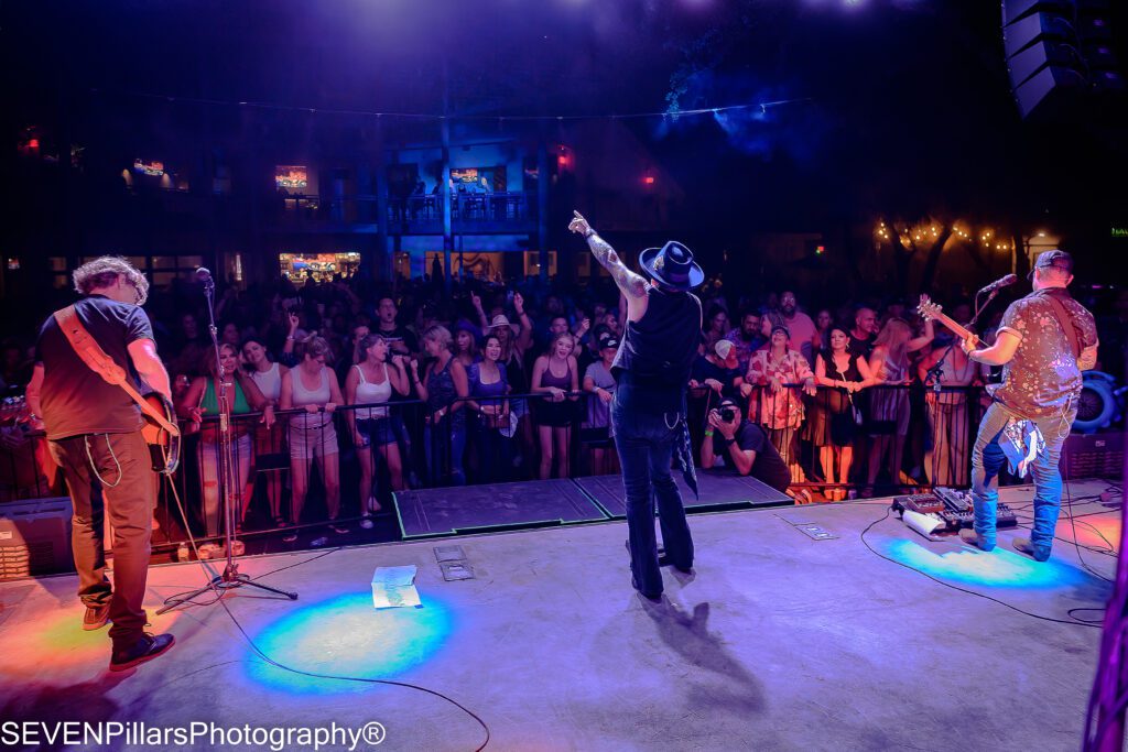 concertgoers singing with the band