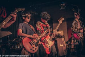 young bassists on stage