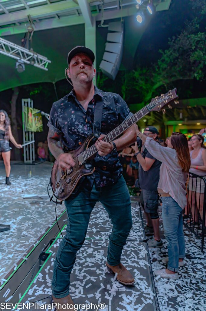 Christopher Skiles holding the guitar