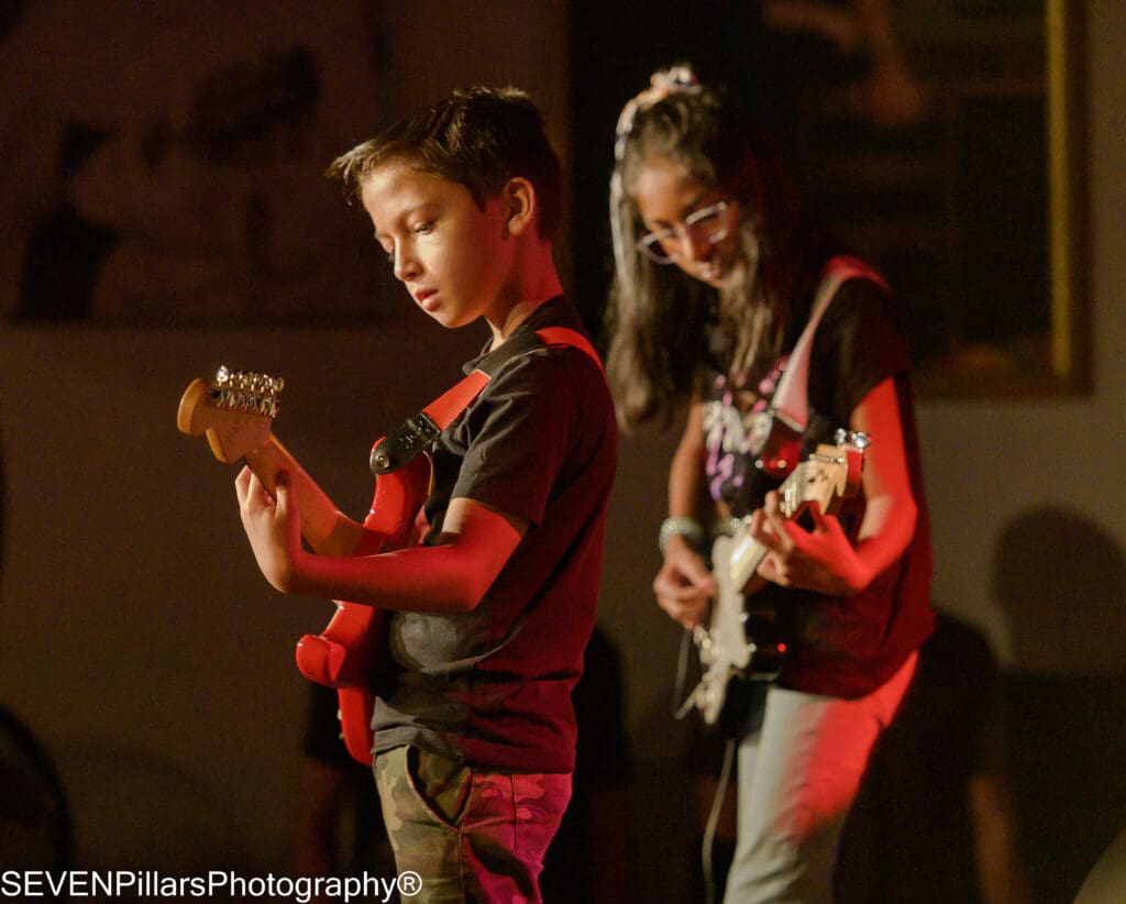 young male and female bassists