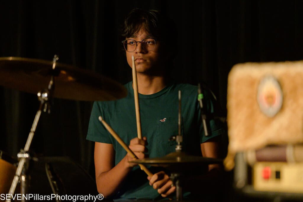 a serious-looking drummer