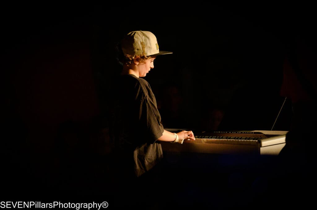 a young boy keyboard player