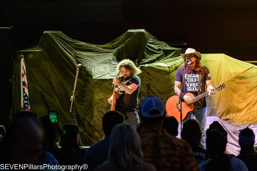 Rick Monroe and The Hitman performing in front of concertgoers