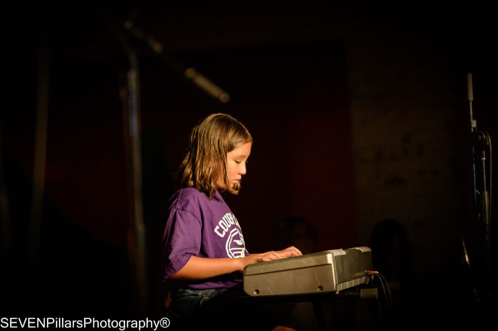 a young girl keyboard player