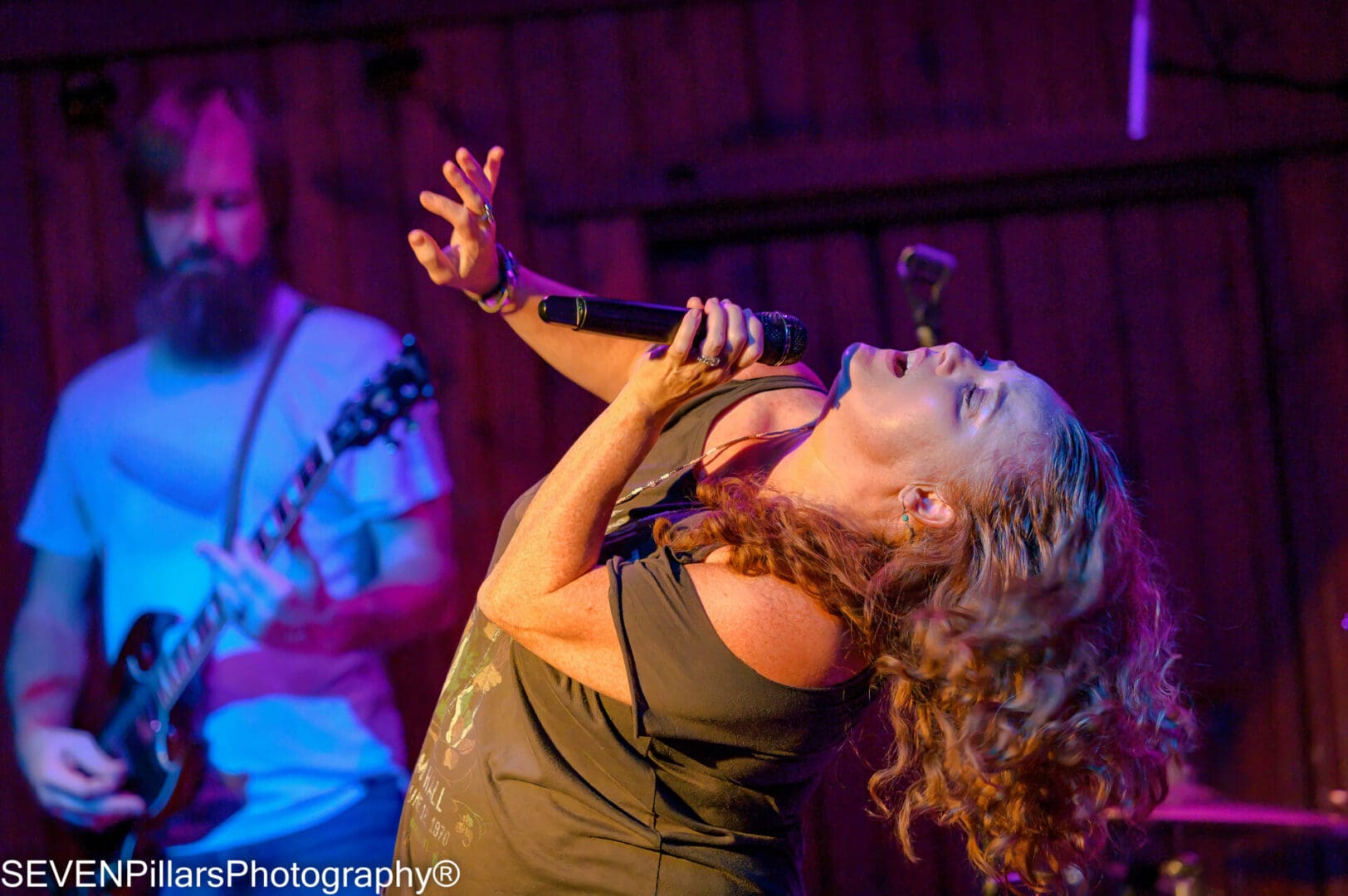 A woman singing on the stage