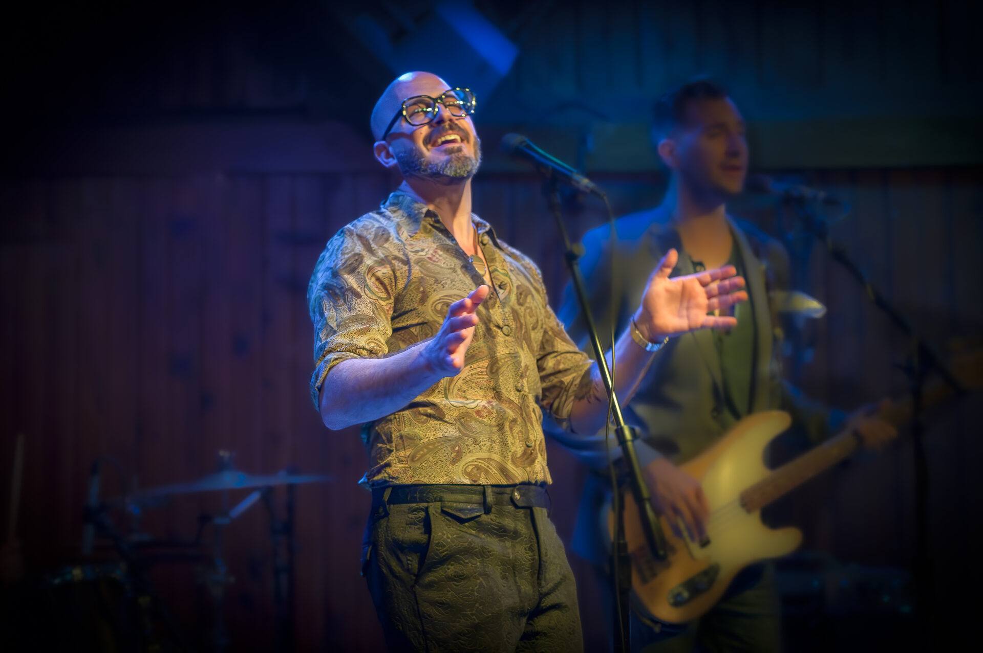 A man is singing into a microphone.