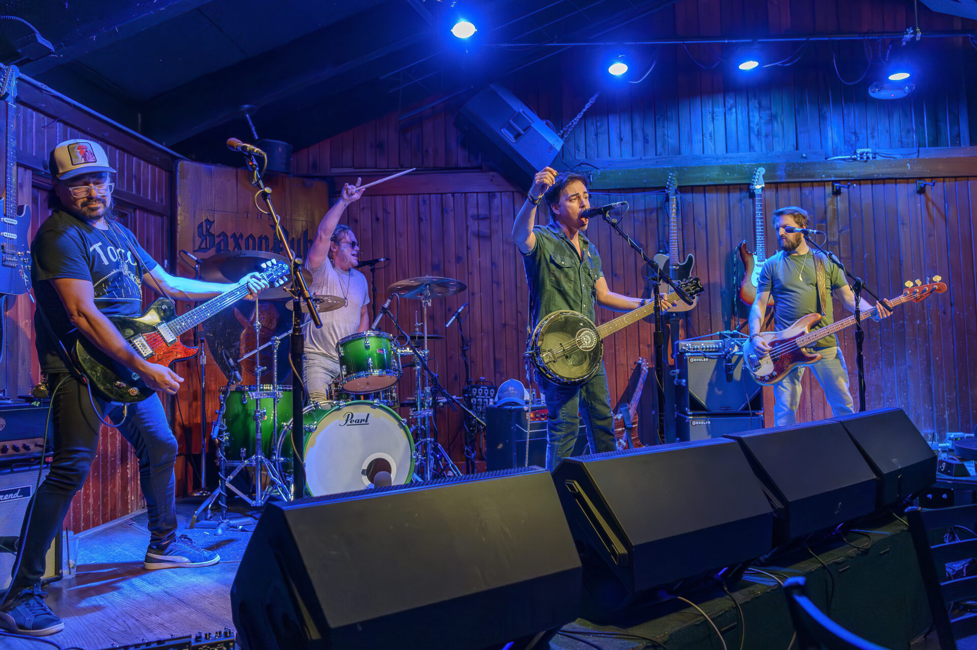 A group of people playing music on stage.