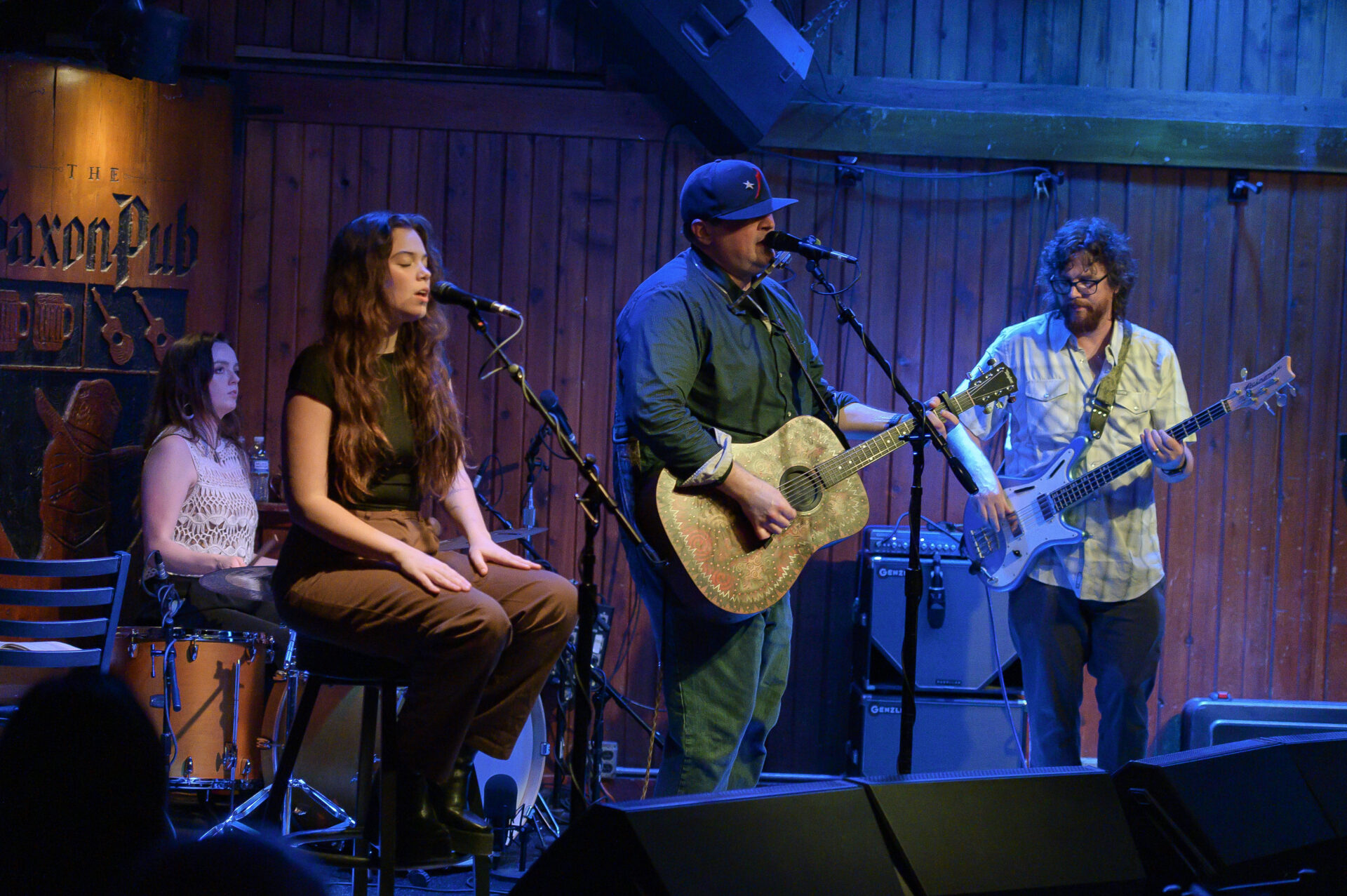 A group of people playing music on stage.